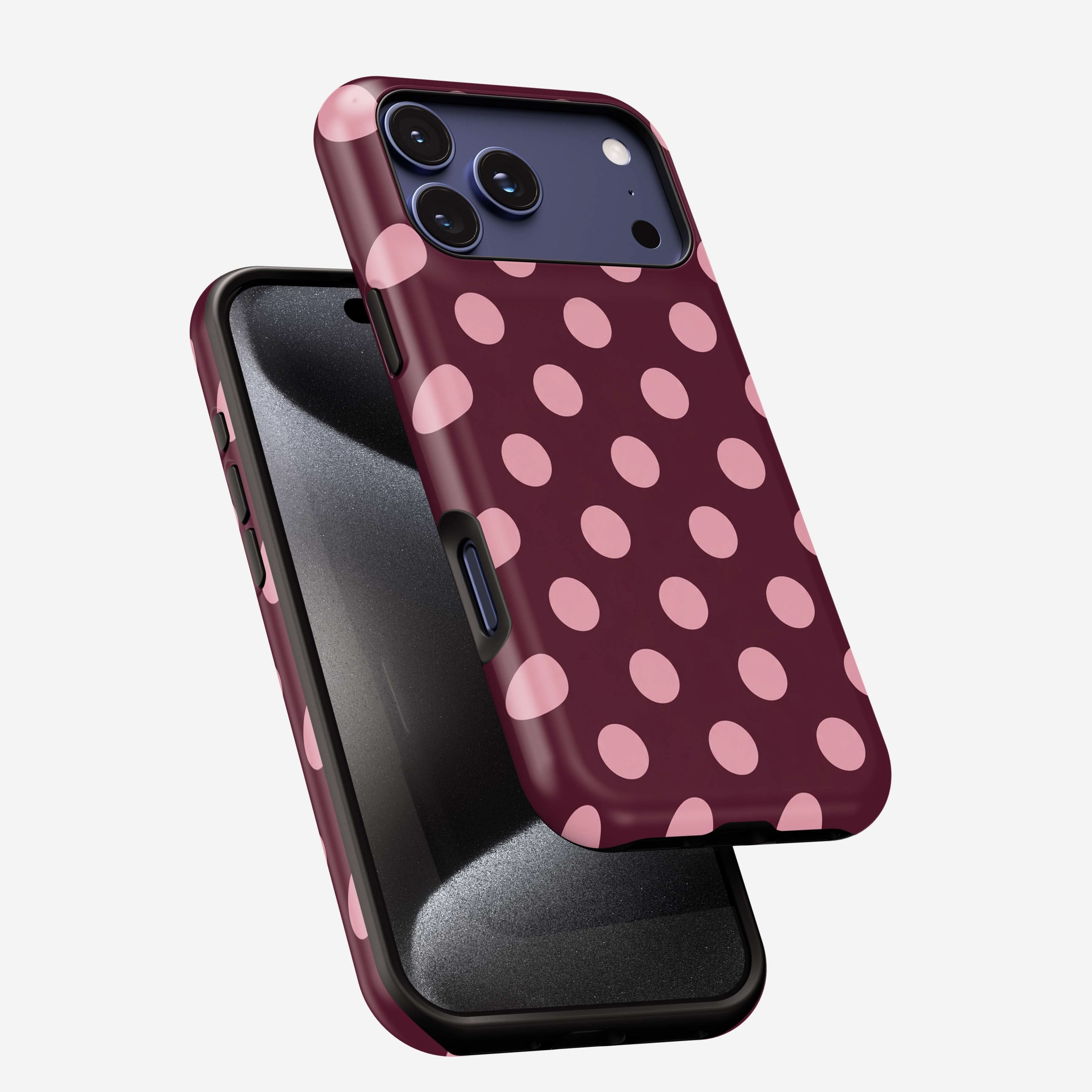 Cherry Soda MagSafe Tough Phone Case with pink polka dots on burgundy background, shown on iPhone 12 Pro.