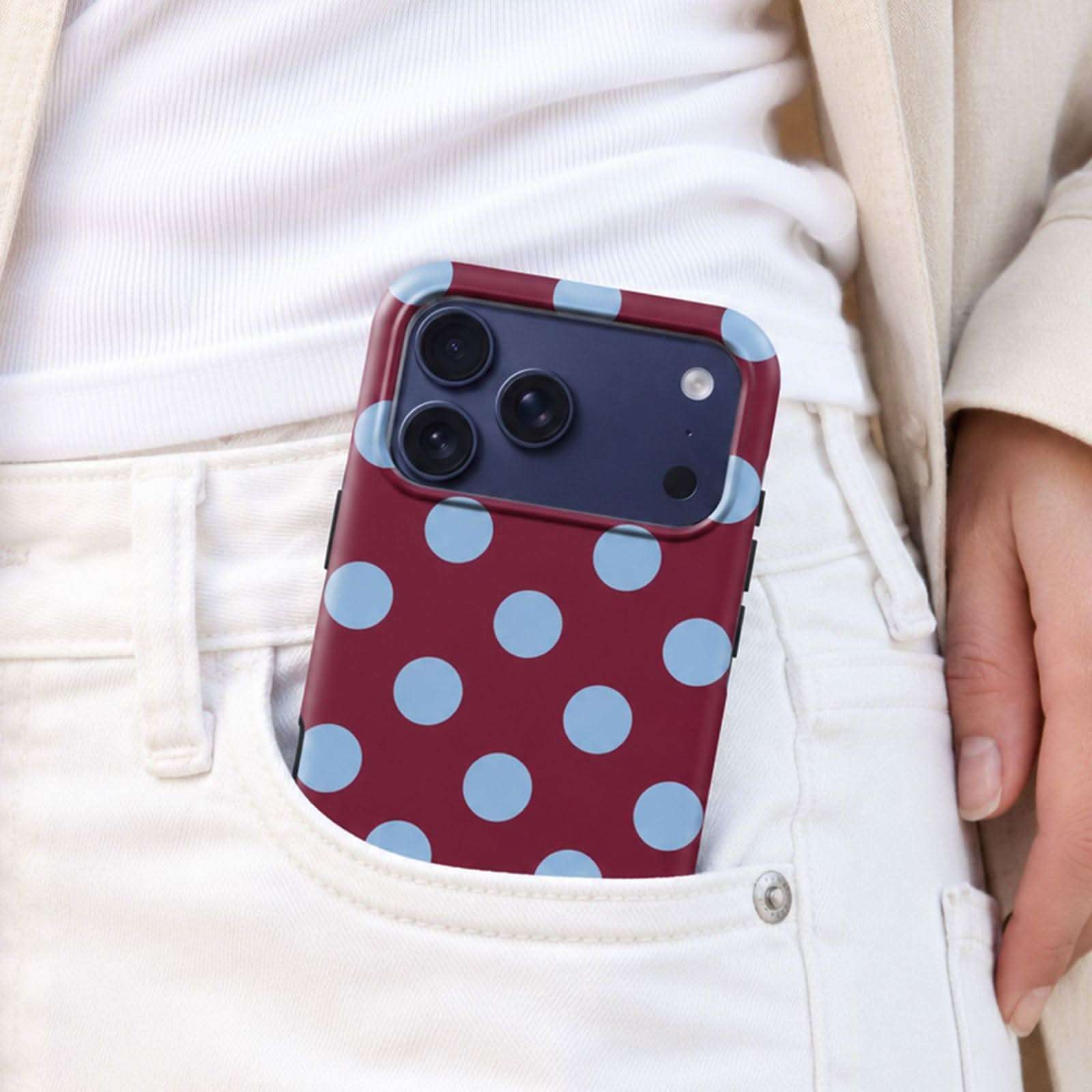 Berry Sky MagSafe Tough Phone Case with polka dot pattern in pocket of white pants