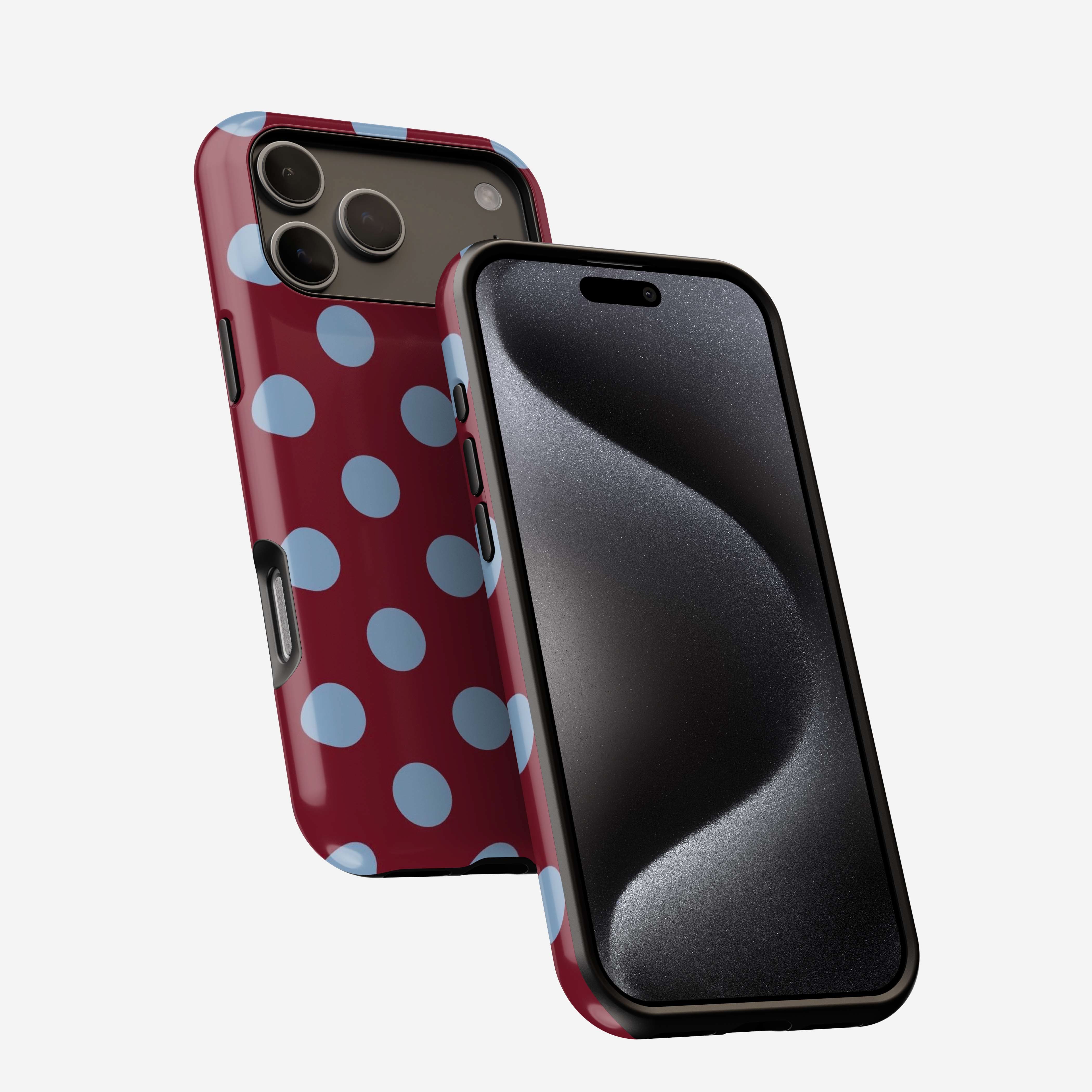 Berry Sky MagSafe Tough Phone Case with light blue polka dots on burgundy background, shown on iPhone.
