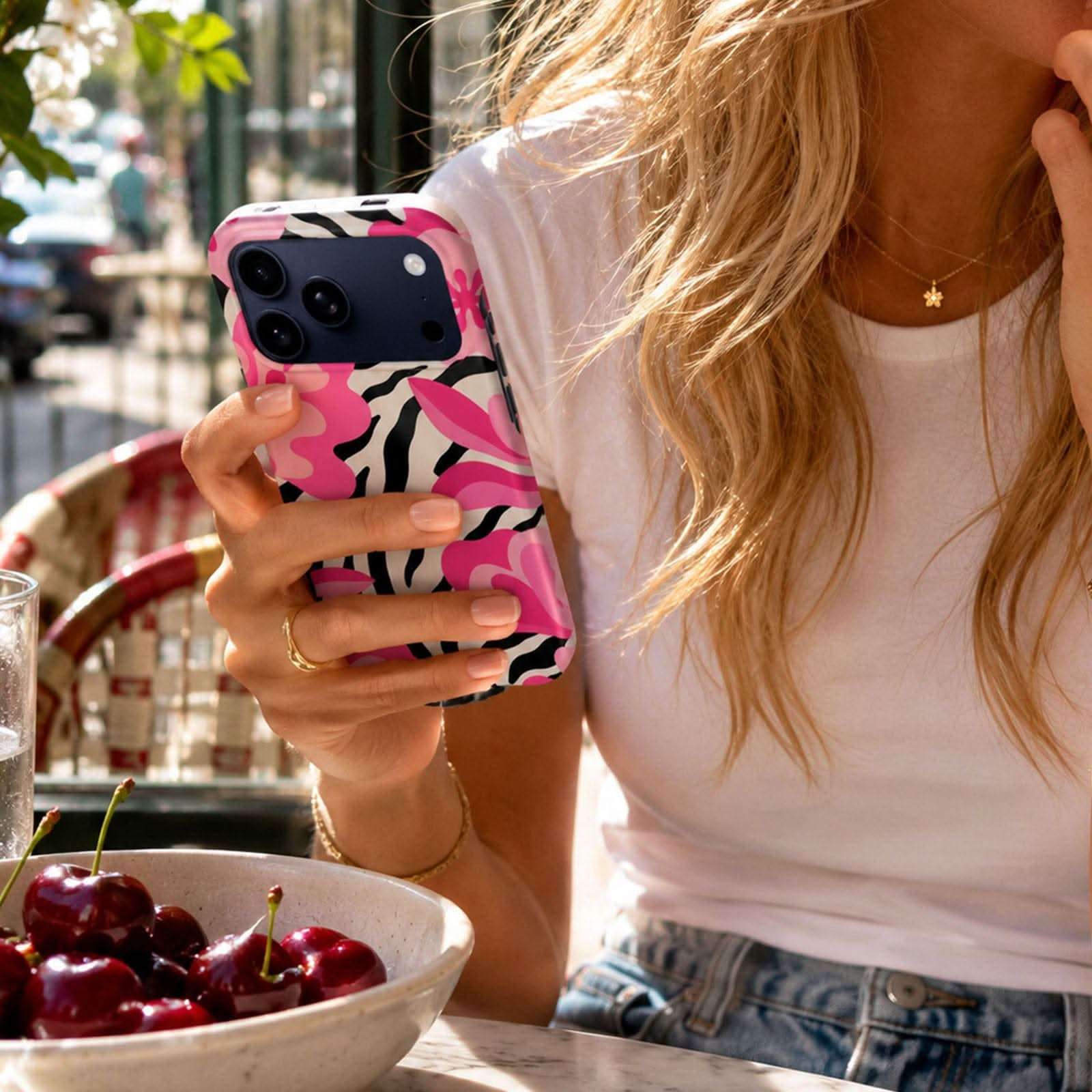Pink Safari MagSafe Tough Phone Case with bold black and pink animal print pattern on iPhone.