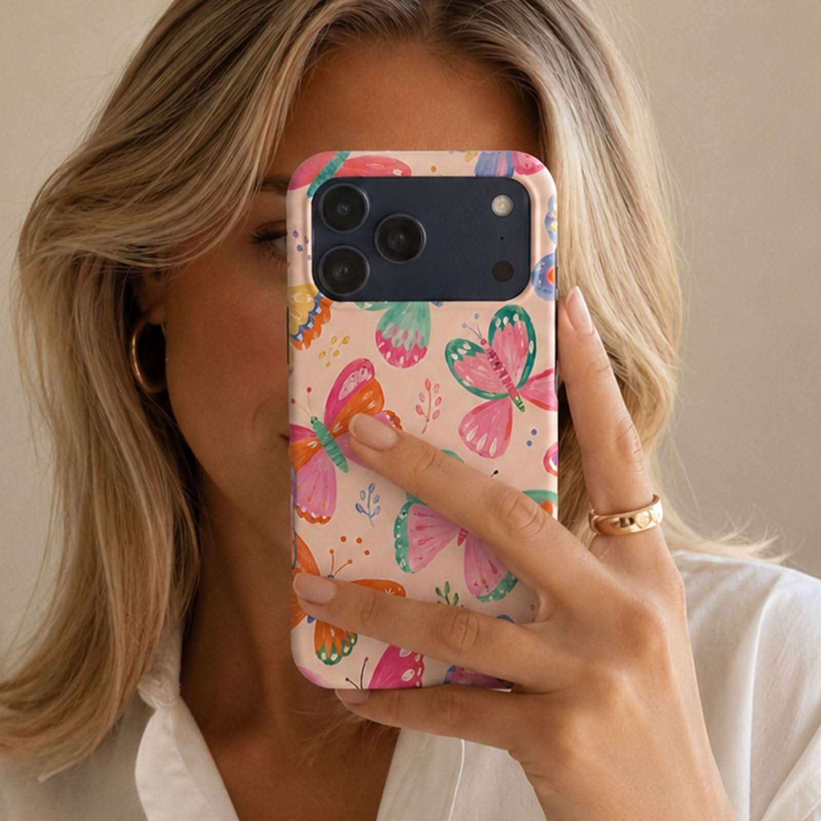 Wing Confetti MagSafe Tough Phone Case with colorful butterfly design on cream background
